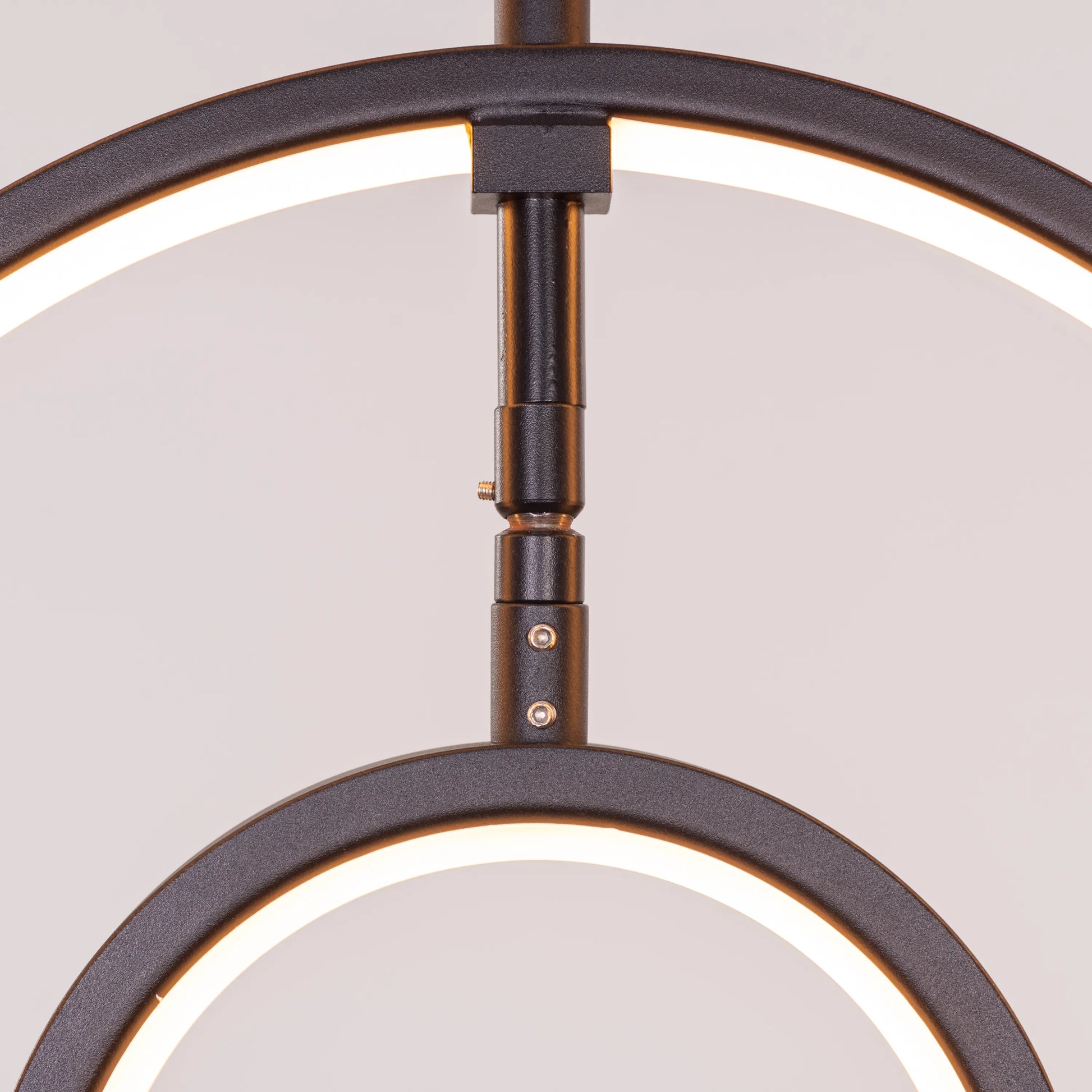 Heatwave Black Chandelier illuminating a room with vibrant amber light, showcasing its unique wave-inspired design