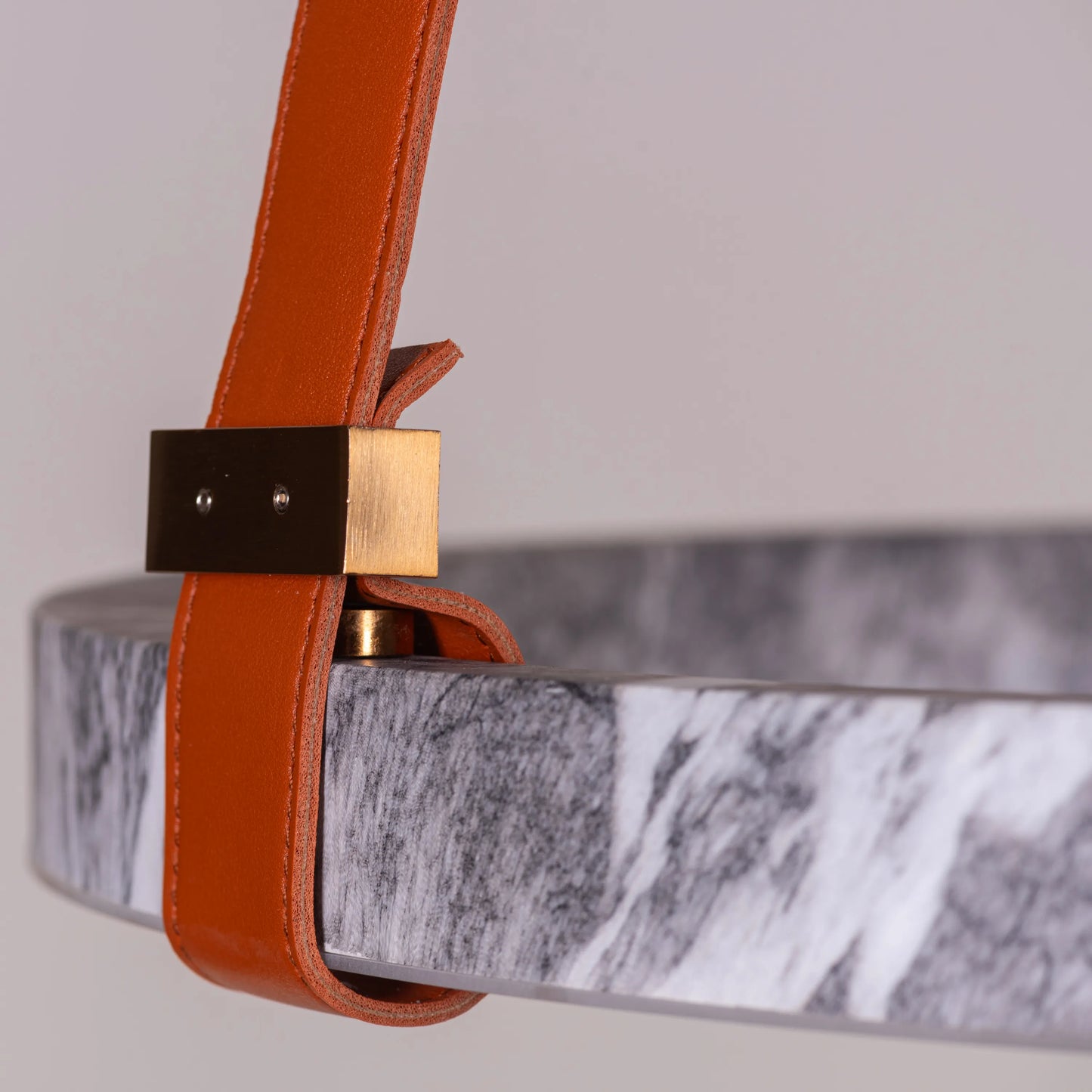 Round grey LED chandelier with slim profile suspended in a modern living room