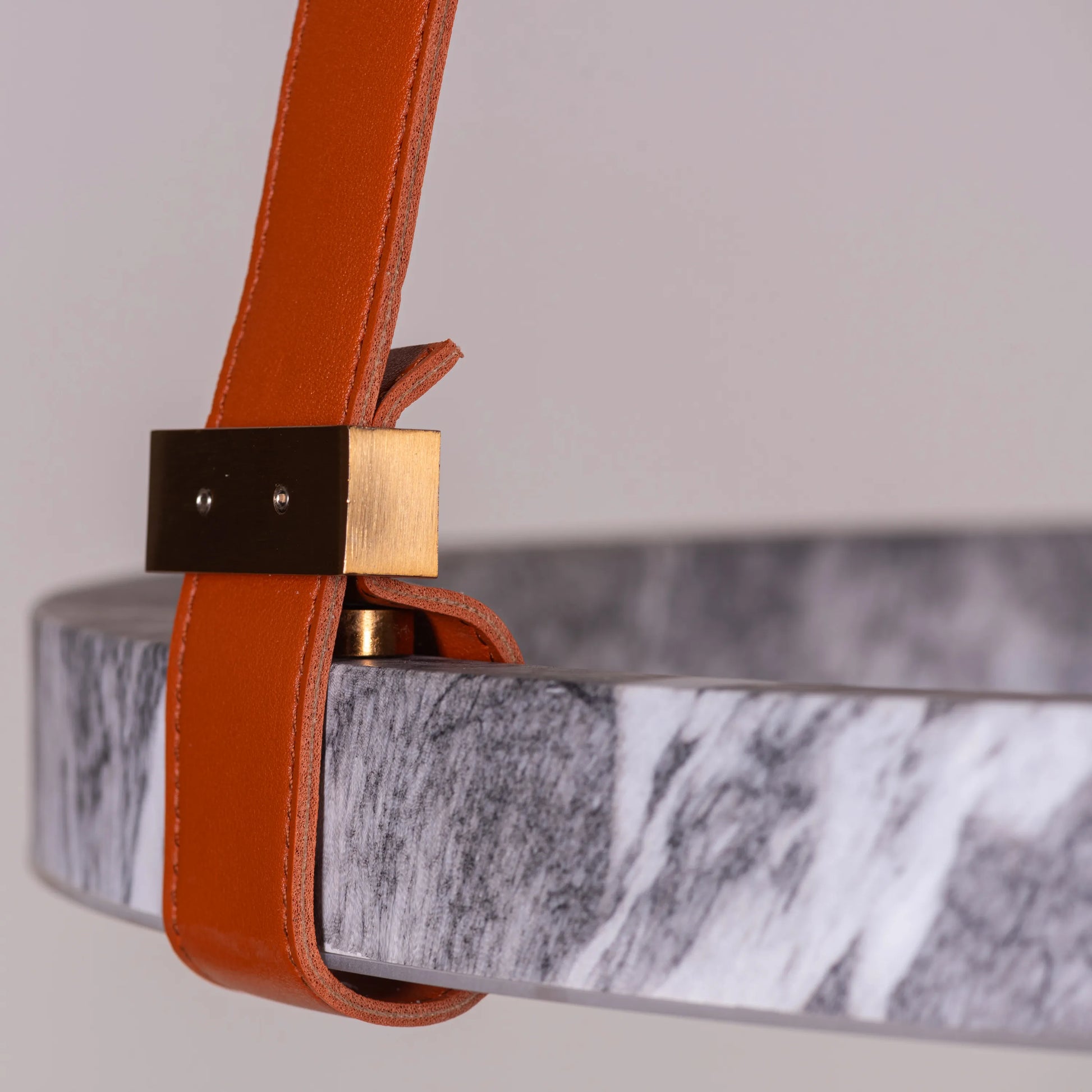 Round grey LED chandelier with slim profile suspended in a modern living room