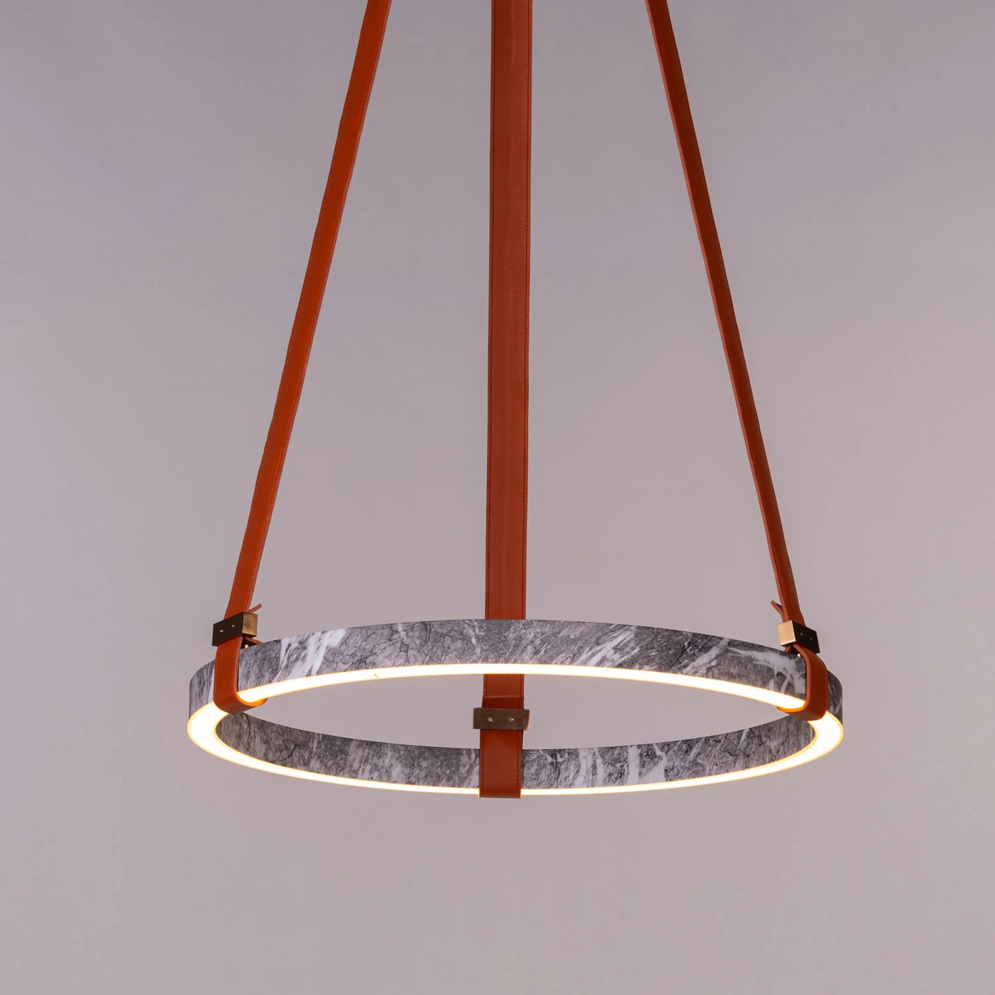 Round grey LED chandelier with slim profile suspended in a modern living room