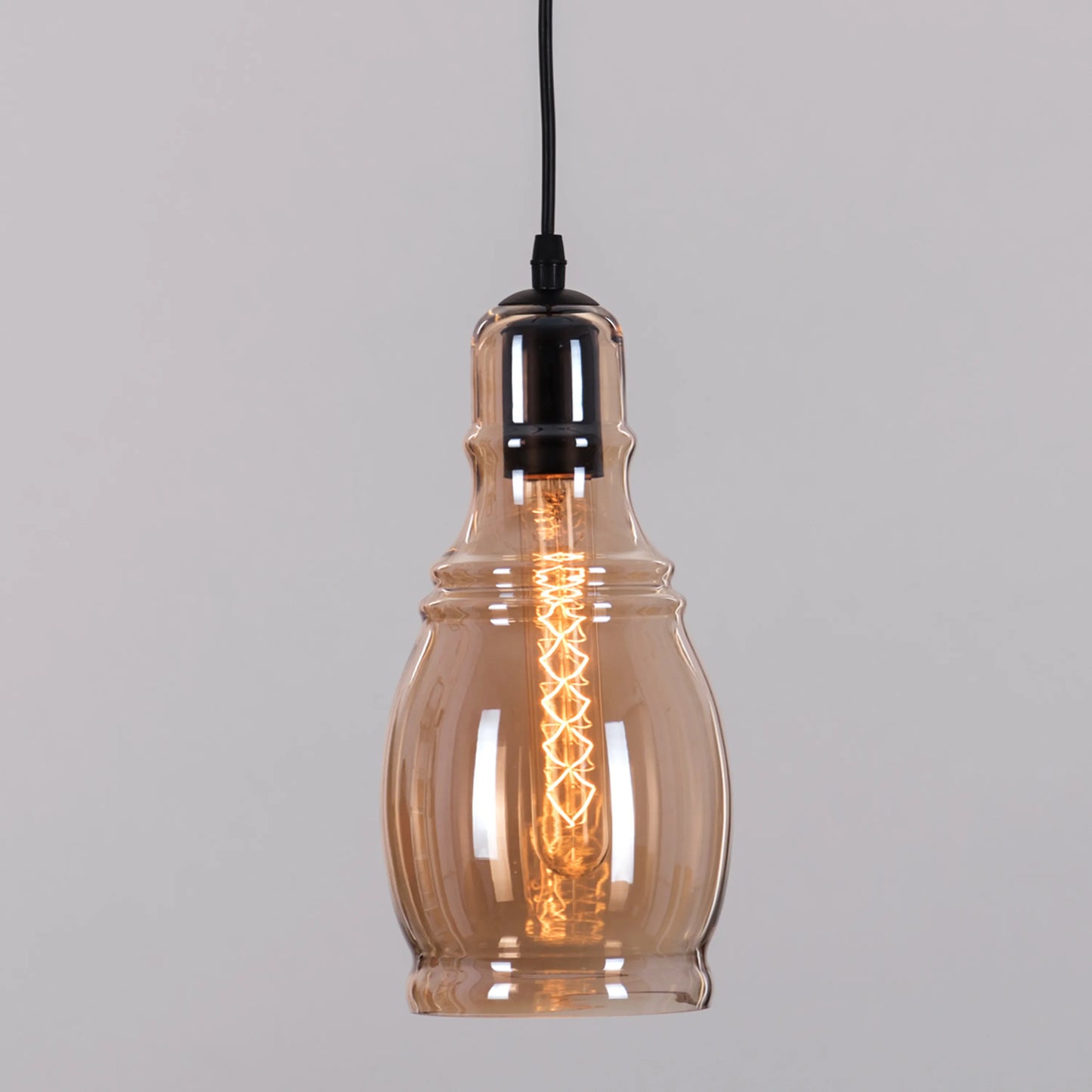 Sophisticated Caramelized Sugar Single Pendant Light with a Blend of Smokey Grey and Amber Glass