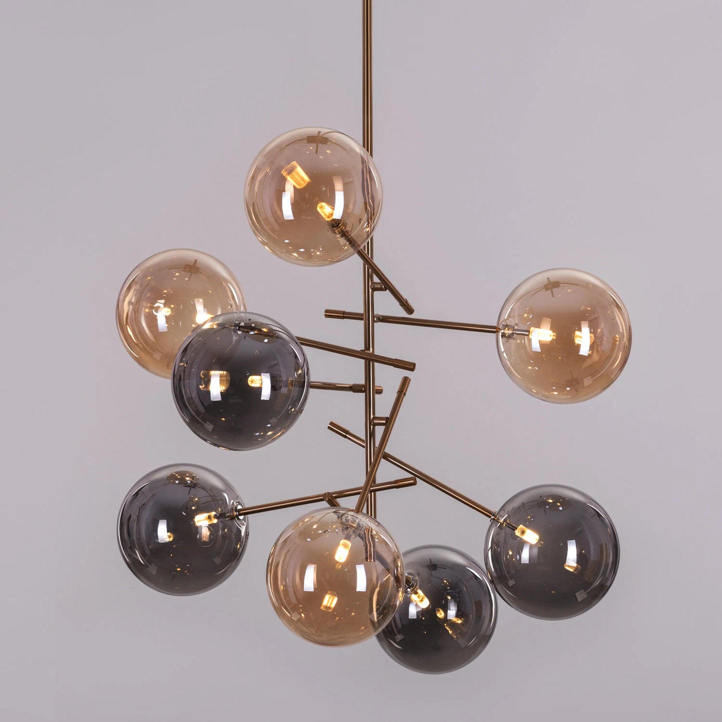 Pied Piper Posh Chandelier in amber and smokey grey finish
