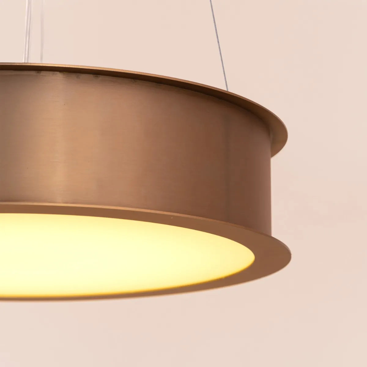 A luxurious pendant light named 'Treasure,' featuring a stunning gold finish and equipped with dimmable LED lights that can be controlled by a remote. The elegant design showcases a modern silhouette, with intricate detailing that catches the eye. This versatile pendant adds a touch of glamour and sophistication, allowing for customizable lighting to create the perfect ambiance in any space.