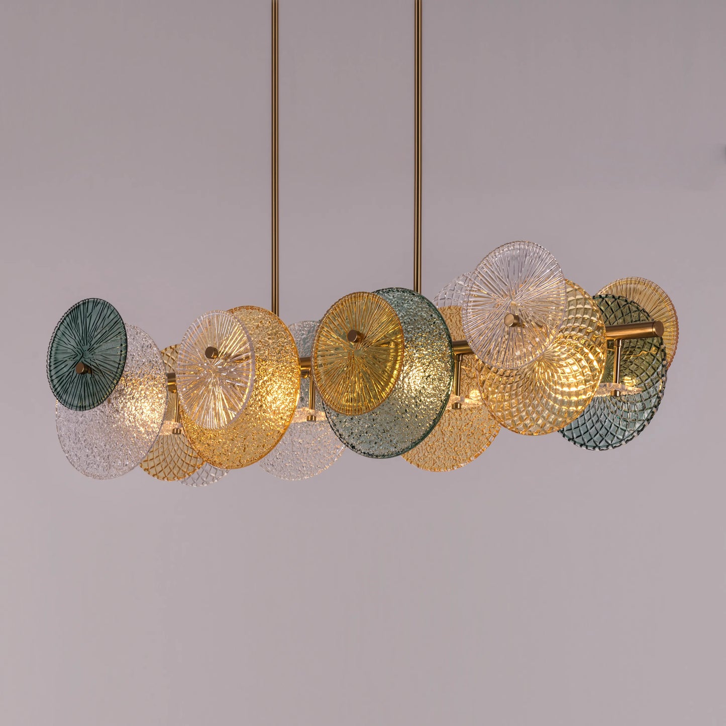 Large horizontal gold chandelier with textured surface in luxurious setting