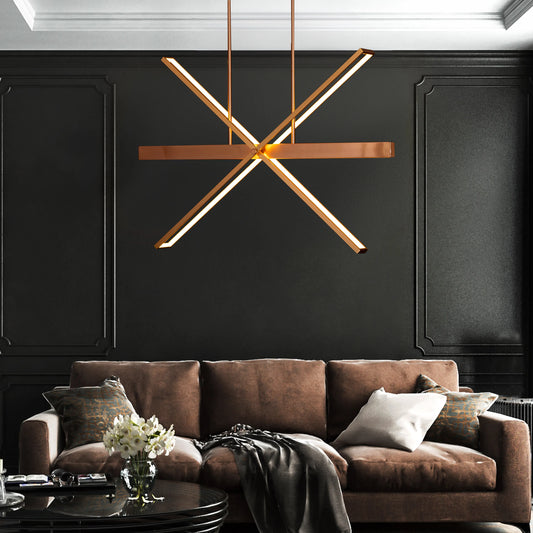 Large gold Pack Your Bags chandelier with dimmable LED lights illuminating a grand foyer