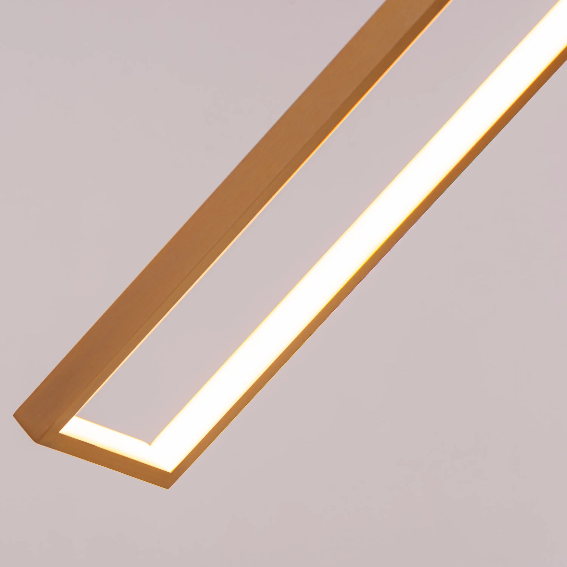 Large gold Pack Your Bags chandelier with dimmable LED lights illuminating a grand foyer