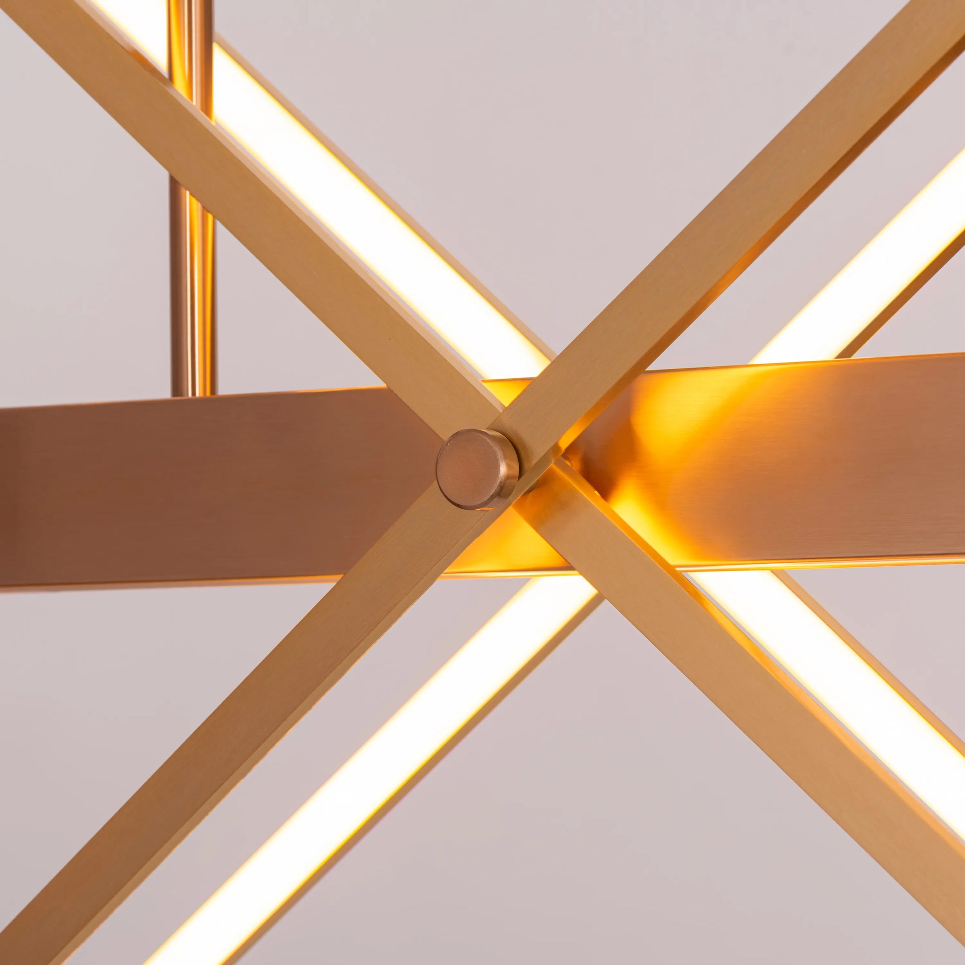 Large gold Pack Your Bags chandelier with dimmable LED lights illuminating a grand foyer