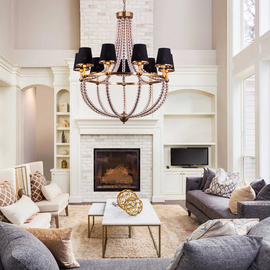 King's Gambit large gold crystal chandelier illuminating a grand entryway