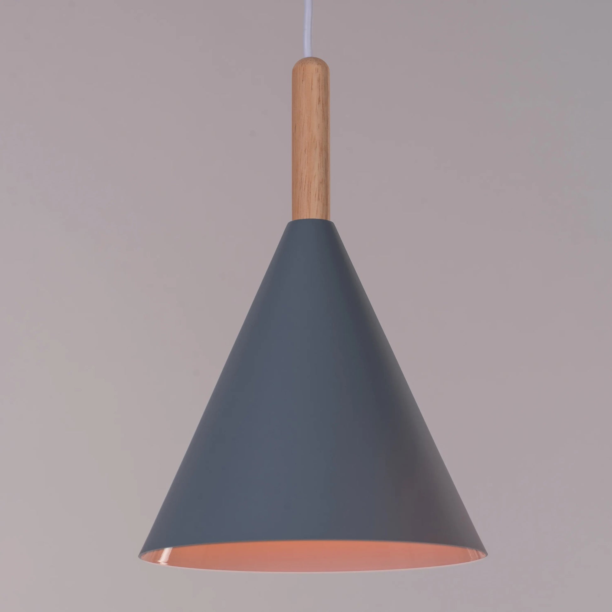A vibrant pendant light named 'Bonus Points,' featuring three hanging heads in a playful combination of blue, green, and white. Each pendant has a smooth, minimalist design with sleek curves, creating a modern and cheerful aesthetic. The multi-colored arrangement adds a pop of color and a fun, dynamic vibe to any room.