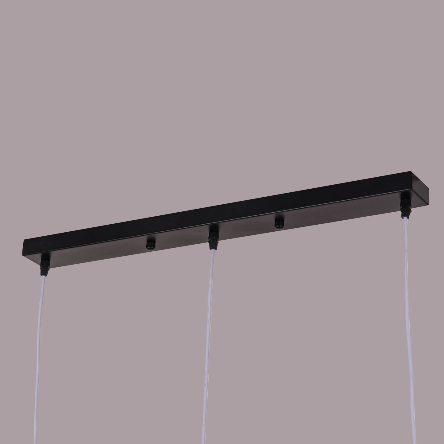 A vibrant pendant light named 'Bonus Points,' featuring three hanging heads in a playful combination of blue, green, and white. Each pendant has a smooth, minimalist design with sleek curves, creating a modern and cheerful aesthetic. The multi-colored arrangement adds a pop of color and a fun, dynamic vibe to any room.