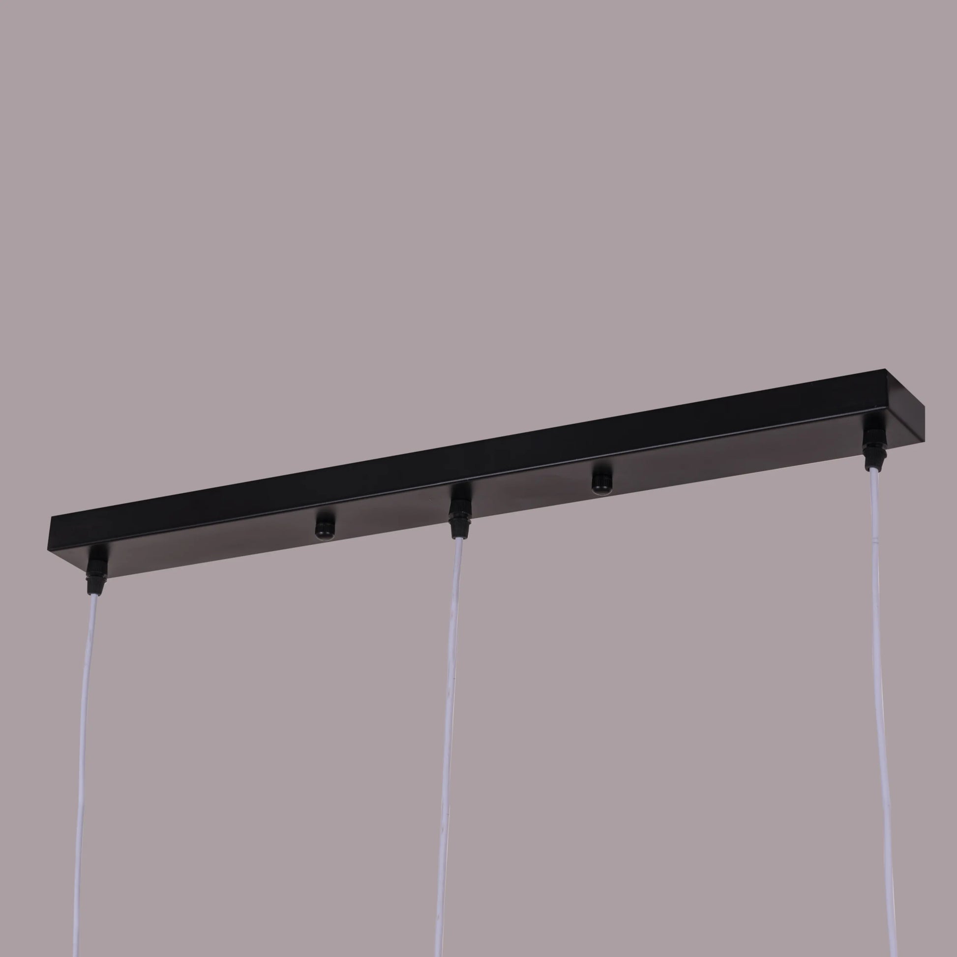 A vibrant pendant light named 'Bonus Points,' featuring three hanging heads in a playful combination of blue, green, and white. Each pendant has a smooth, minimalist design with sleek curves, creating a modern and cheerful aesthetic. The multi-colored arrangement adds a pop of color and a fun, dynamic vibe to any room.