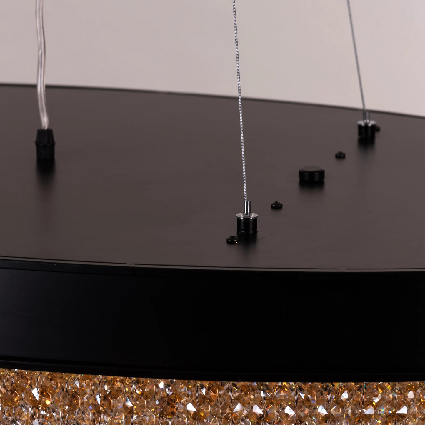 Close-up of Black Tie chandelier's intricate black frame and crystal details