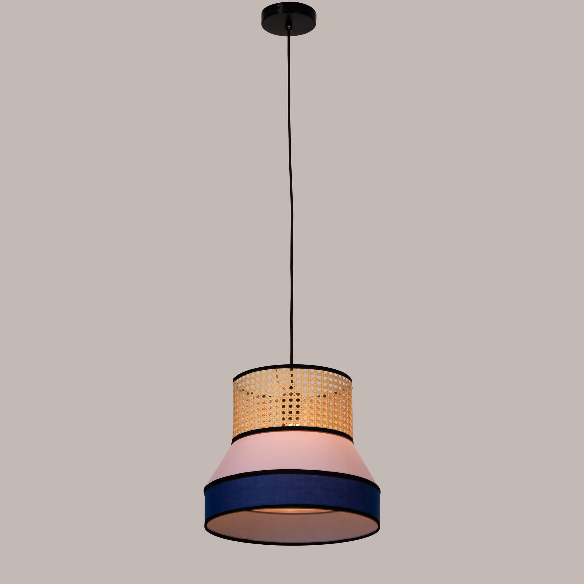 Make The Tea pink and blue rattan pendant light illuminating a modern dining room