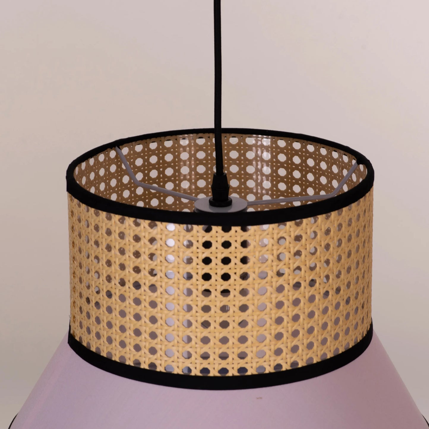 Make The Tea pink and blue rattan pendant light illuminating a modern dining room