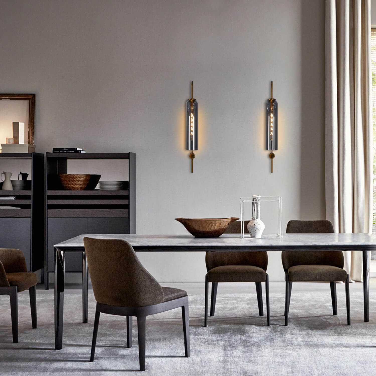 Ancestral wall beacon, gold metal and glass, echoes of heritage.