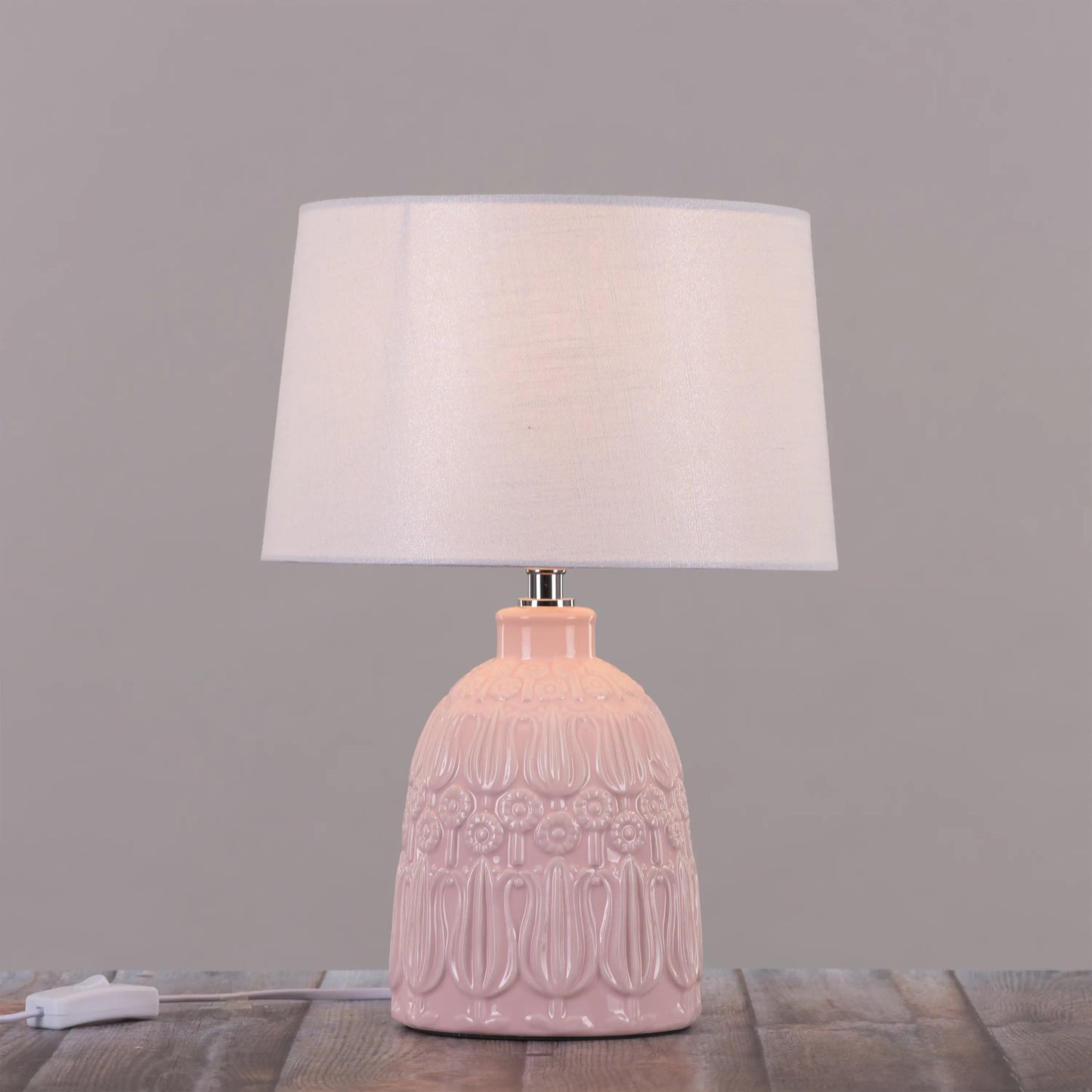 Uplifting glow from a pink table lamp