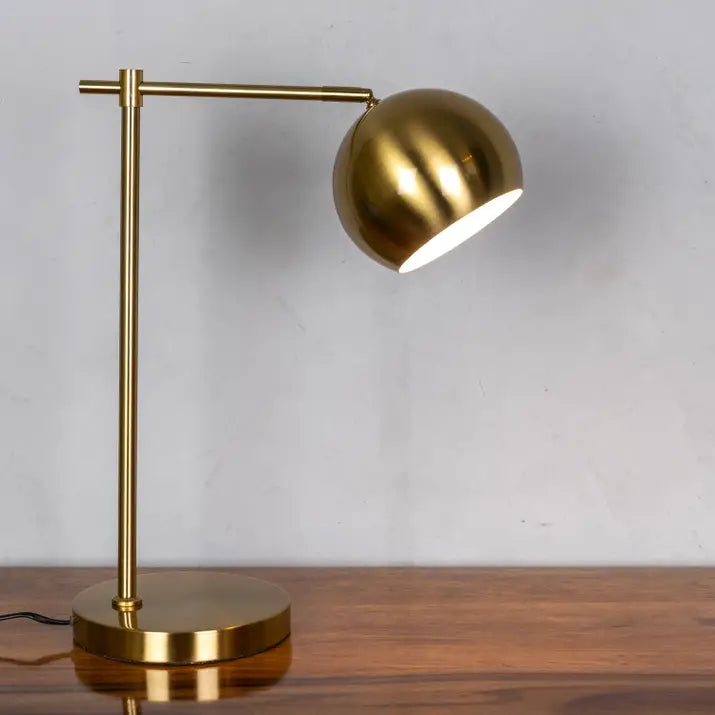 Focused beam and ambient lighting in gold lamp
