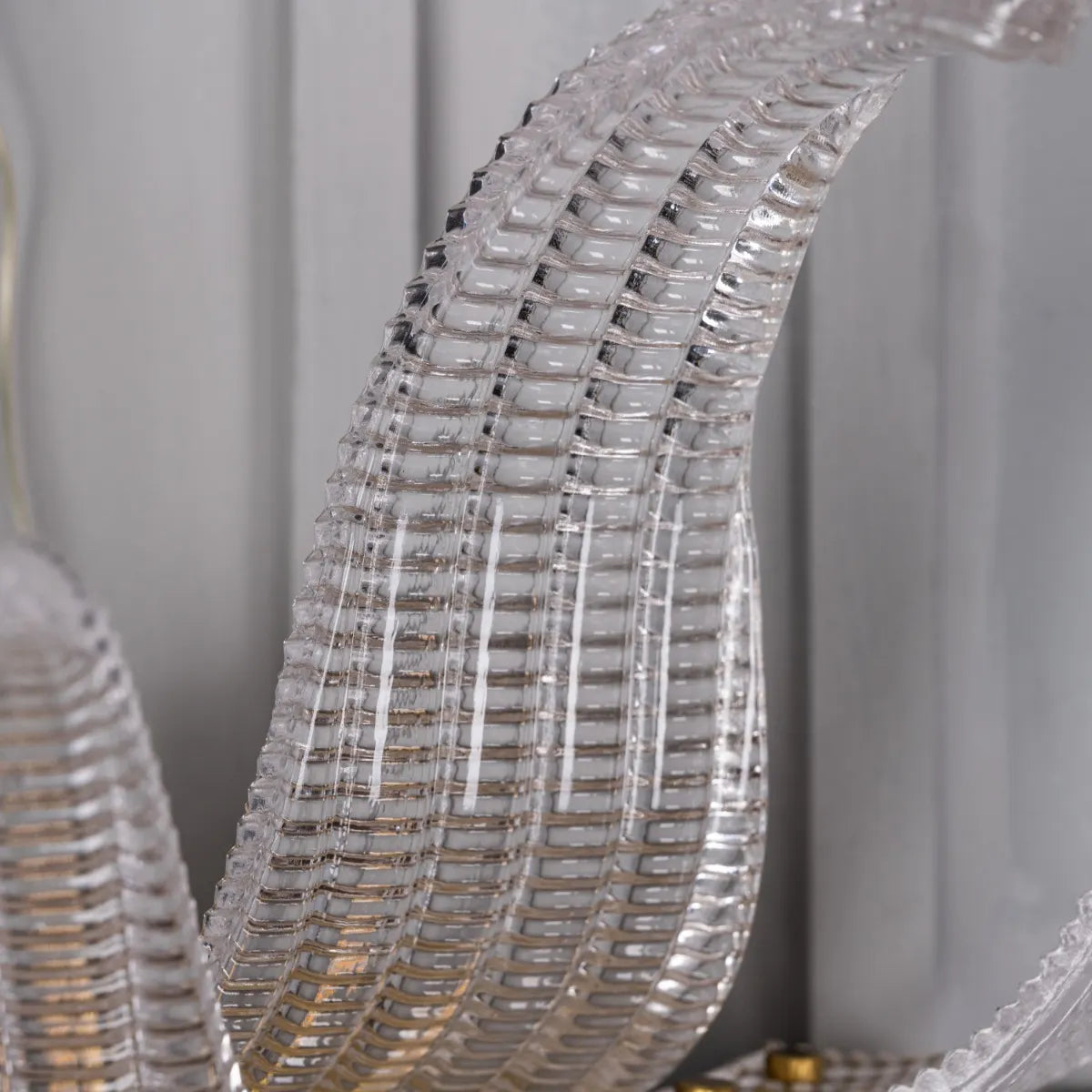 Satin Brass Wall Light Fixture - A high-quality, energy-efficient wall light with a minimalist metal frame and a captivating interplay of light and shadow.