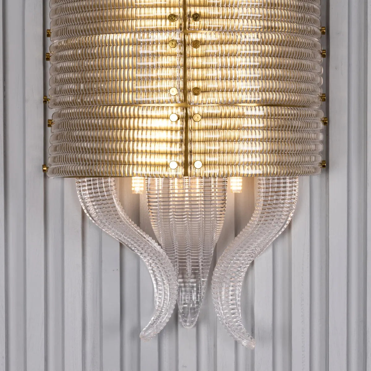 Satin Brass Wall Light Fixture - A high-quality, energy-efficient wall light with a minimalist metal frame and a captivating interplay of light and shadow.