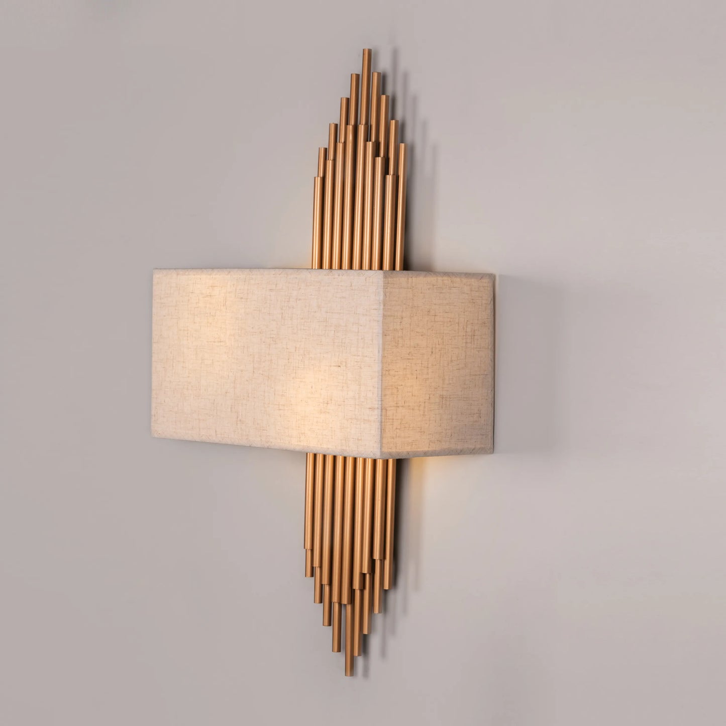 Modern gold and off-white wall light inspired by cityscape design; adds warm ambient lighting and urban elegance to luxury interiors.