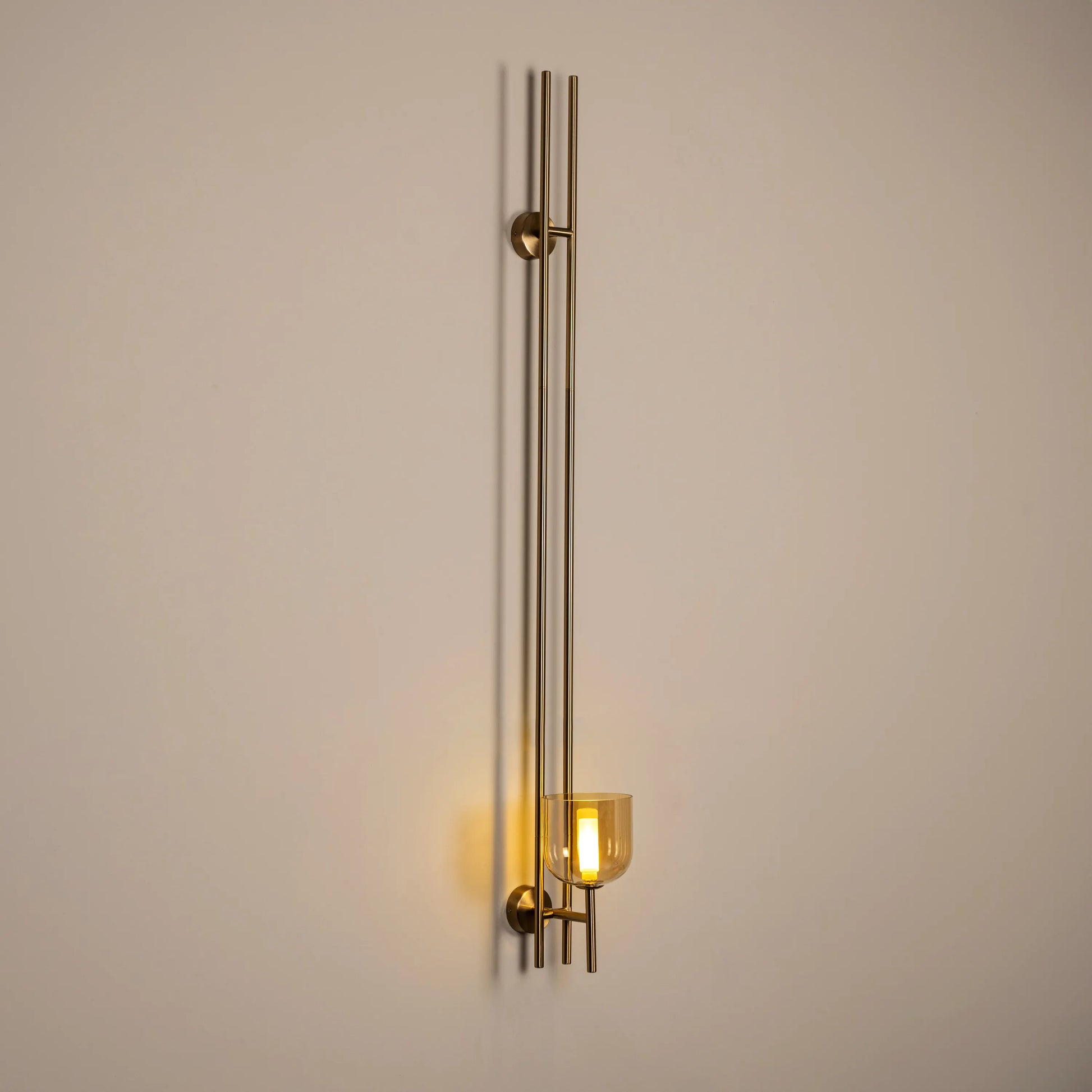 Moments Matter Wall Light in Gold and Amber with Clear Glass – luxury wall light featuring a golden frame, amber accents, and clear glass for an elegant and radiant glow, perfect for sophisticated interiors.