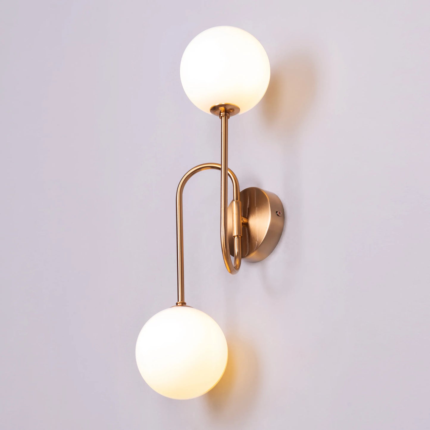 "Many Moons Away" Frosted Glass Wall Light - A sleek, modern wall sconce with a frosted glass shade that diffuses warm, glowing light.