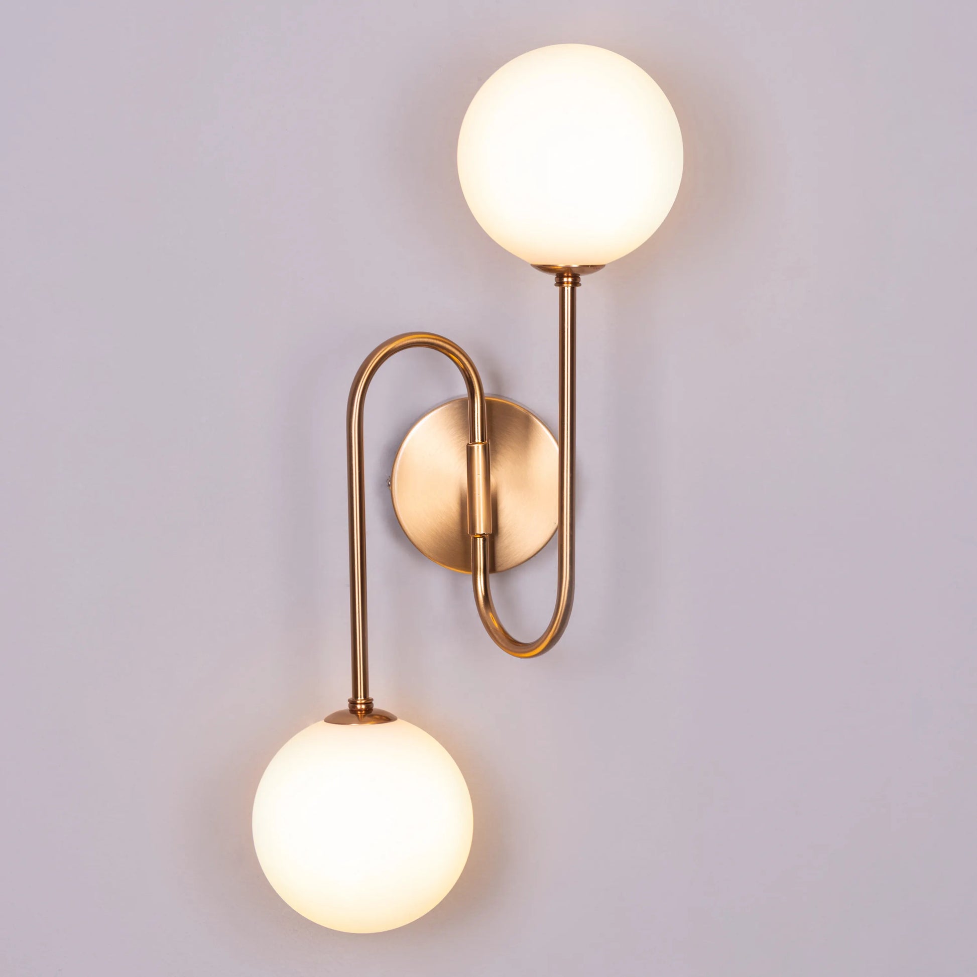 "Many Moons Away" Frosted Glass Wall Light - A sleek, modern wall sconce with a frosted glass shade that diffuses warm, glowing light.