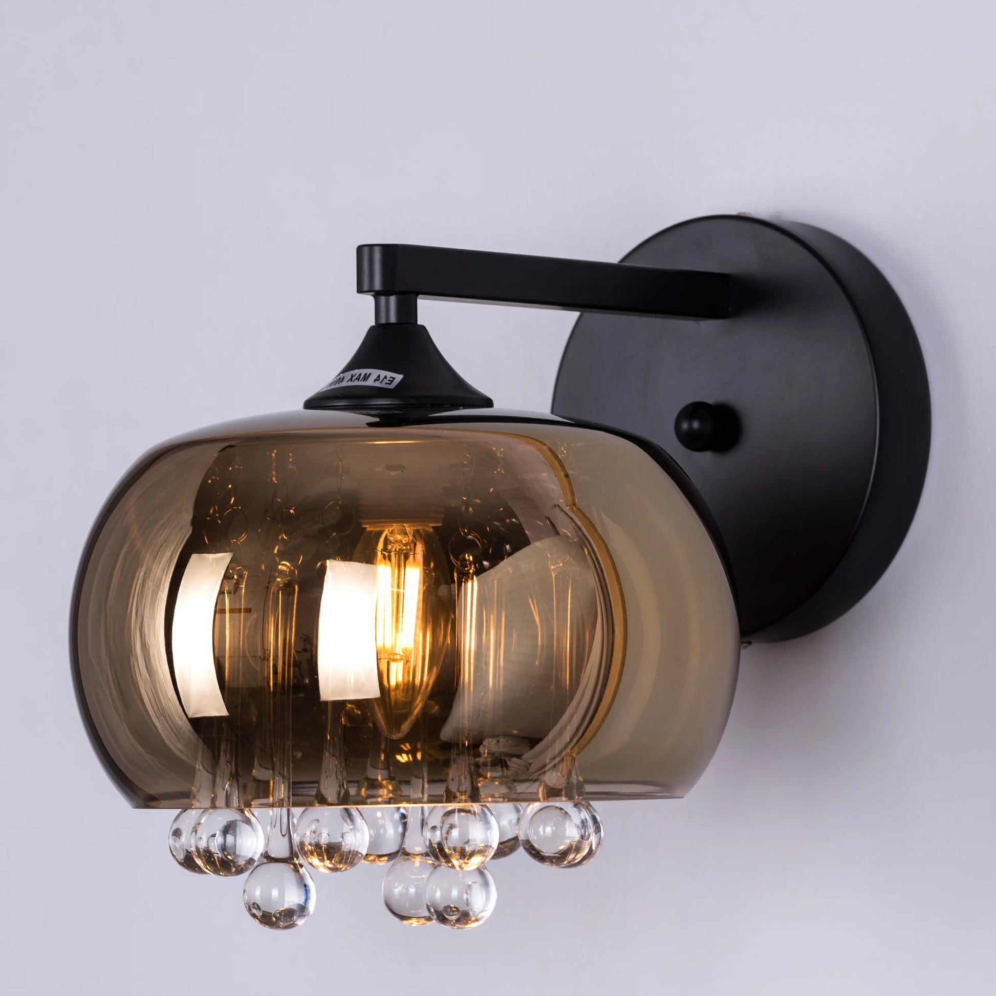 Luxurious Enchanted Crystal Wall Light featuring premium cut crystals arranged against a sophisticated black and gold framework, creating dramatic light refractions and elegant illumination patterns