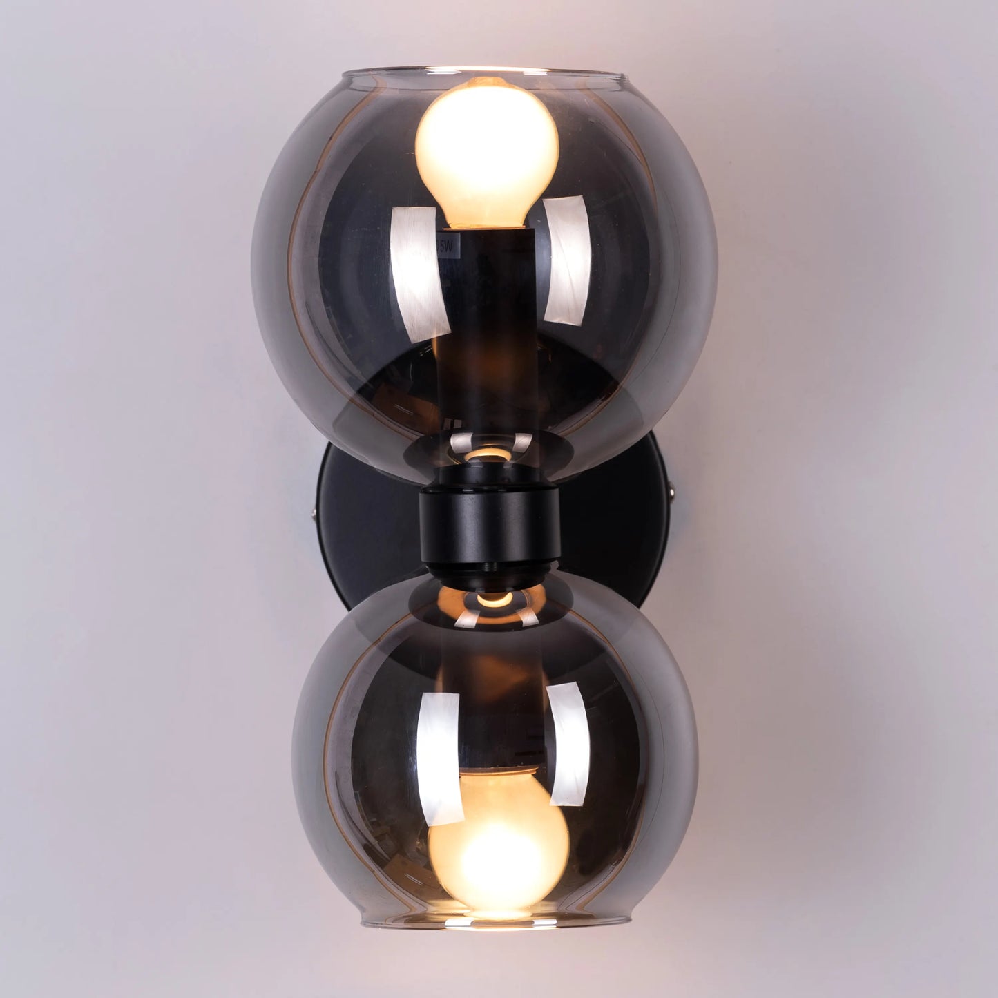 Afloat Glass Wall Light – elegant and minimalist wall light with a floating glass shade, offering soft, ambient illumination for a tranquil and stylish atmosphere.