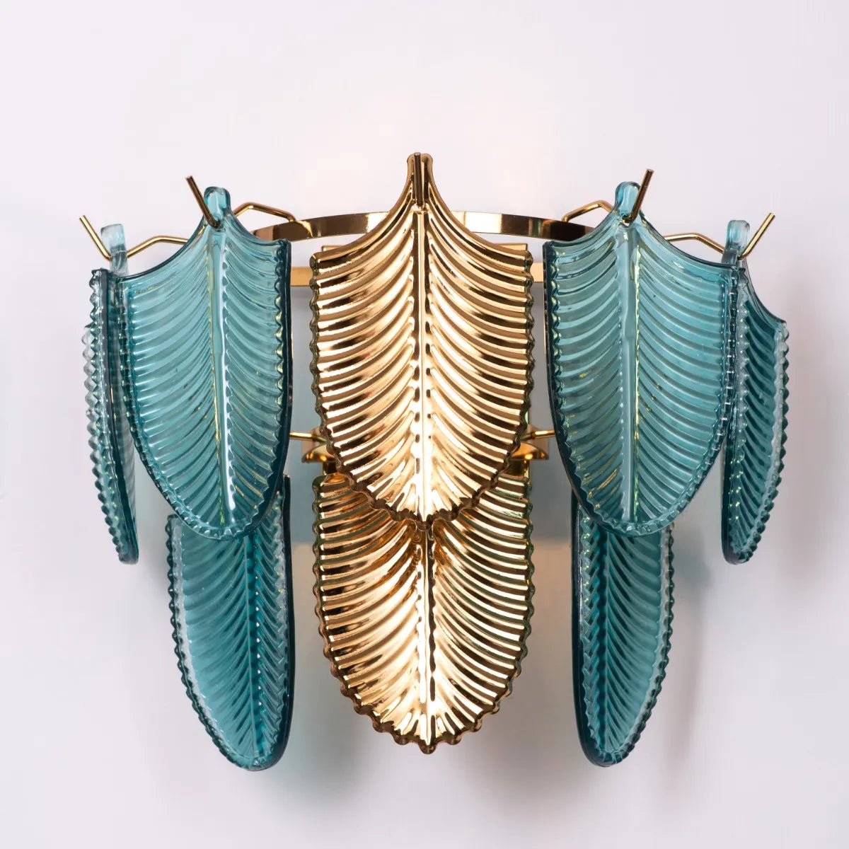 Magic In Milan glass wall light casting a warm glow in a modern living room.