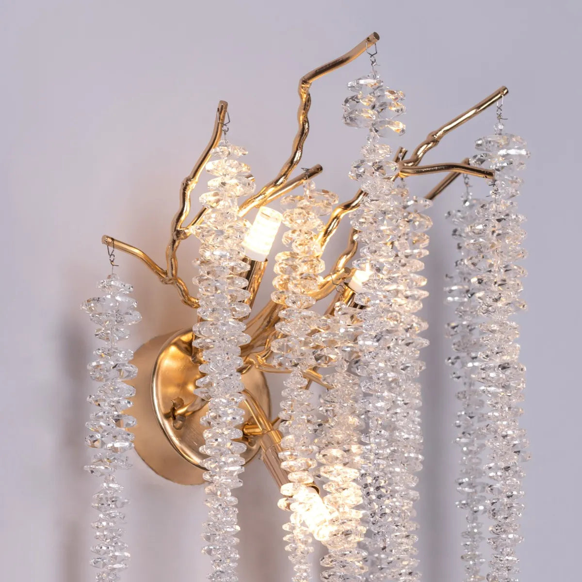 Up with the Fairies Crystal Wall Light - Enchanting and whimsical wall lighting fixture featuring a cluster of beautifully faceted crystal elements suspended within a sleek metal frame, creating a mesmerizing play of light and shadow.