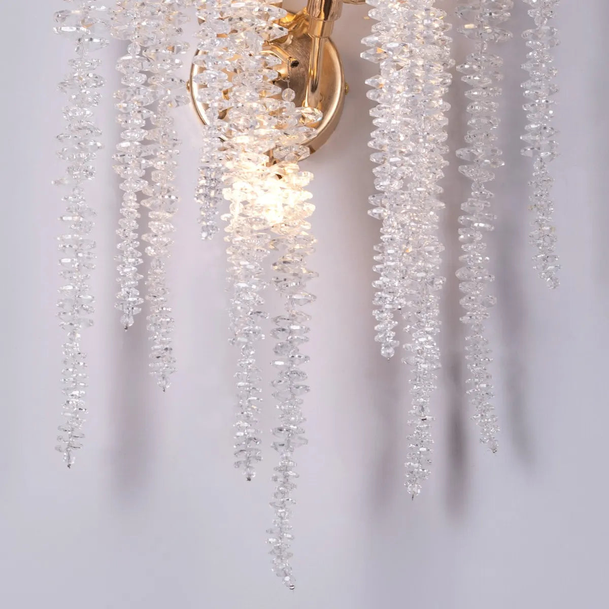 Up with the Fairies Crystal Wall Light - Enchanting and whimsical wall lighting fixture featuring a cluster of beautifully faceted crystal elements suspended within a sleek metal frame, creating a mesmerizing play of light and shadow.